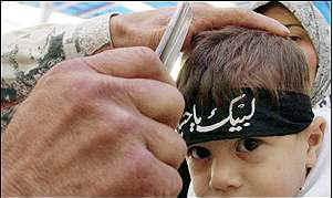 A father mutilating his son to bleed